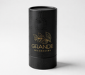 Black cylindrical perfume bottle packaging with 'Grande Fragrances' branding on a light gray background